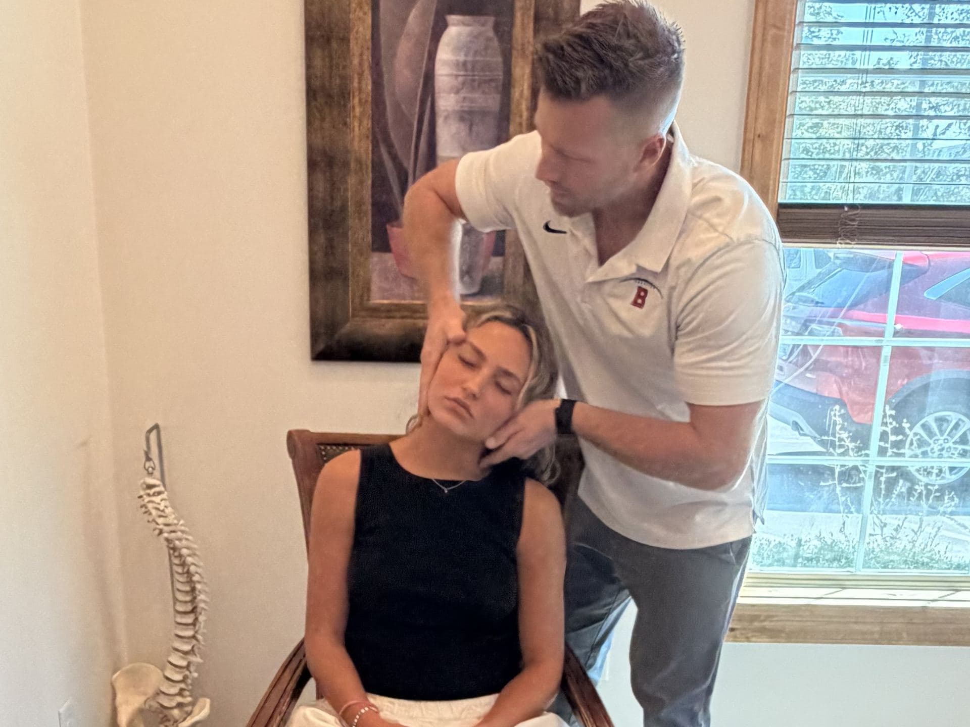 Chiropractic neck adjustment at Elevate Wellness Chiropractic